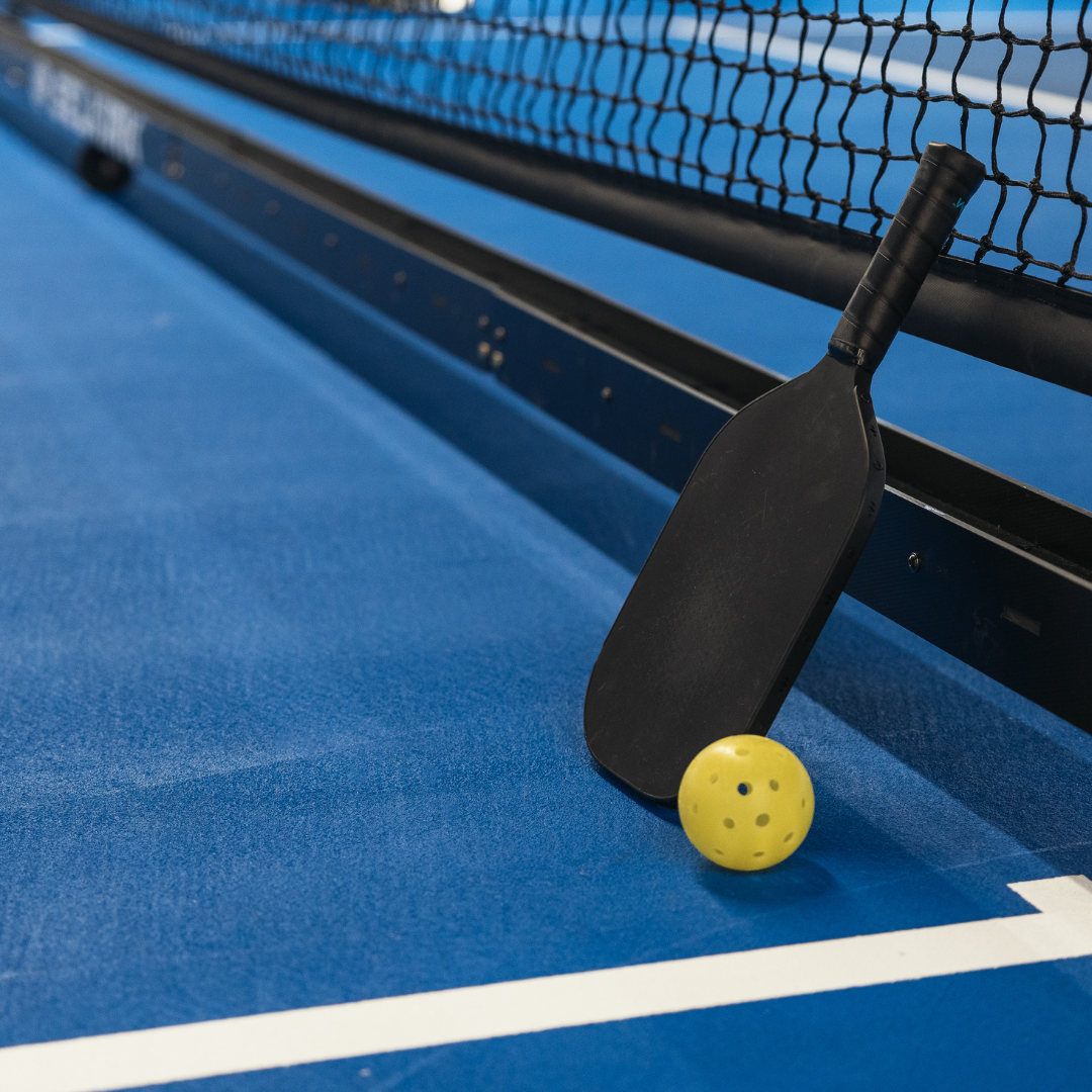 pickleball paddle on a court