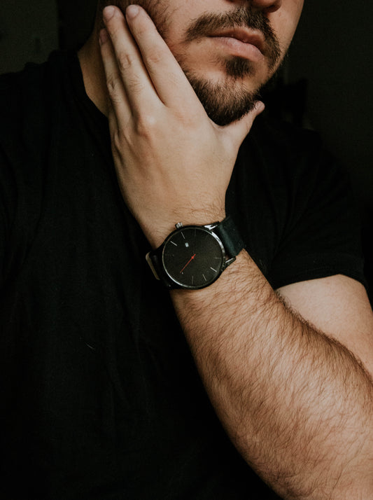man applying Imperium beard oil